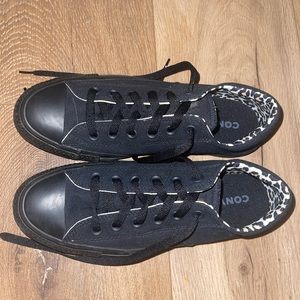 size 8.5 woman’s converse. black on outside and leopard print on the inside